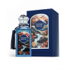This image displays the Safari Breeze bottle alongside its intricately illustrated presentation box, highlighting the artistic coastal-inspired design.